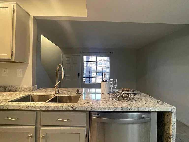 Kitchen with a view of patio outside.