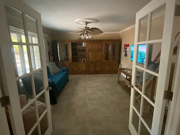 French doors leading into the front room with "built in" cabinets for storage