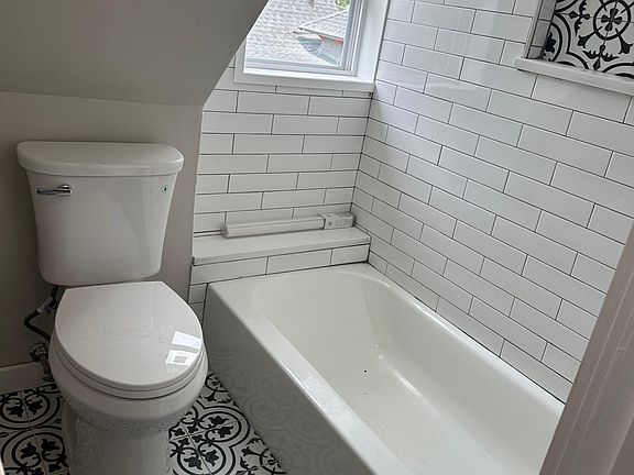 new tub with subway tiles
