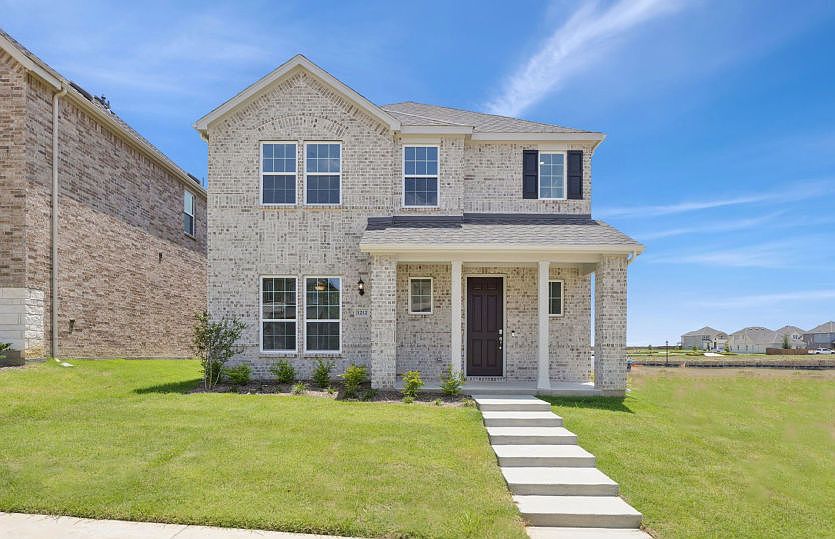 The Shadygrove, with covered front patio and 2-car rear-entry garage