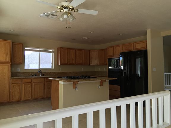 Kitchen w/island cooktop granite counters