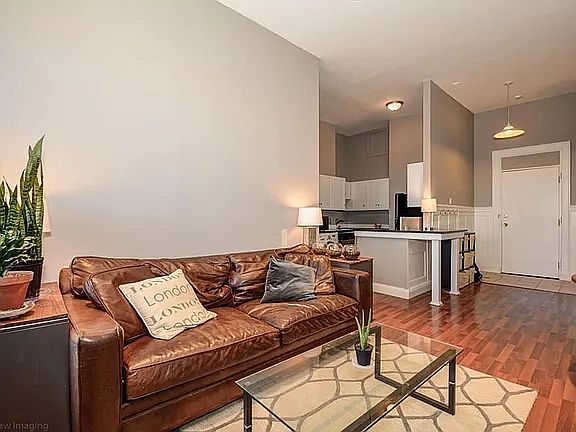 Living room opens to breakfast bar/nook and fully equipped/nicely updated kitchen.