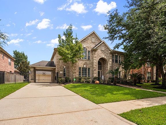 This fabulous home features a private driveway gate, carport & 3 car garage.