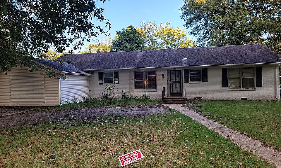 huge front yard with mature 