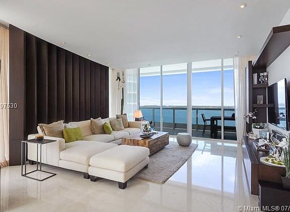 Living room area - opens towards wrap around extra large balcony with direct bay views