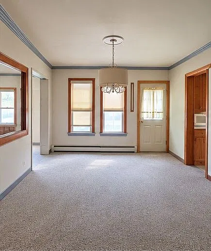 Cute 2 Bed/ 1 Bath Lower Unit, with a great 3 season front porch, and corner lot with a nice yard. — Photo 1