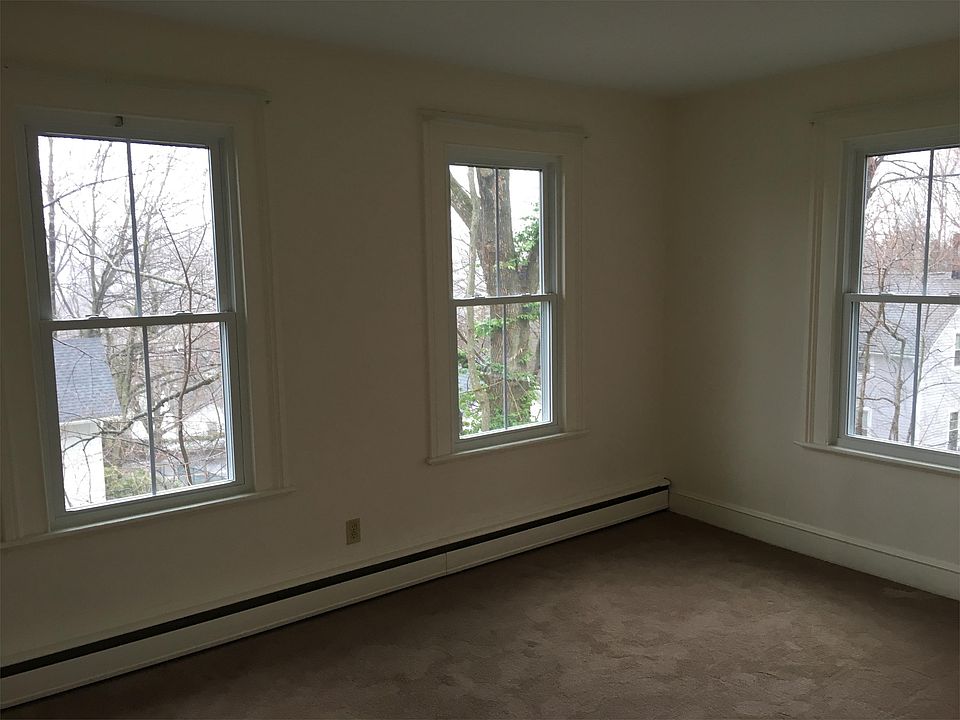 Dining room with new carpet and new replacement windows.
