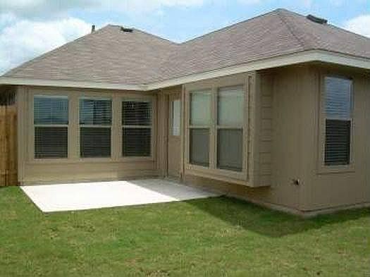 Back of house with patio