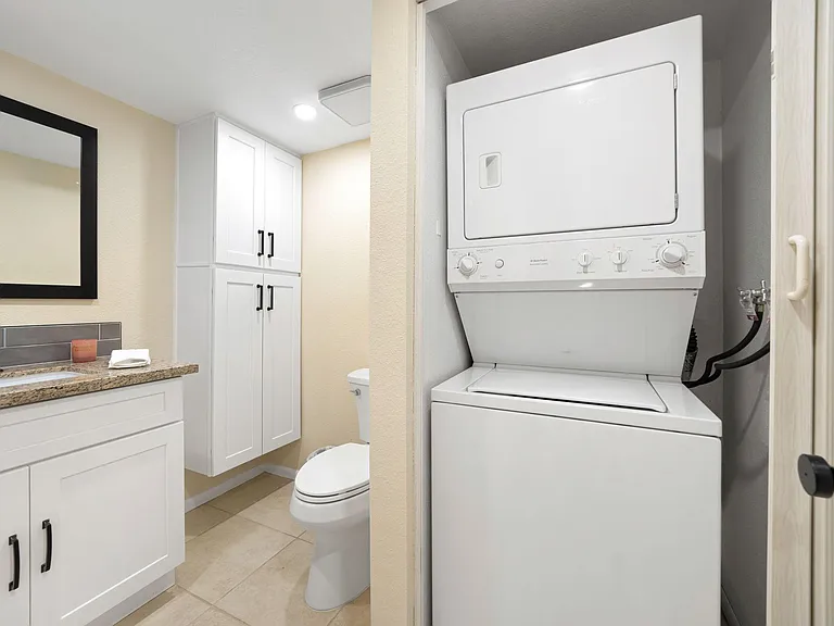Laundry area on lower level in powder room.