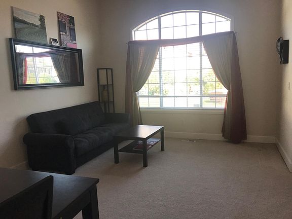 Formal living room with tall ceiling.