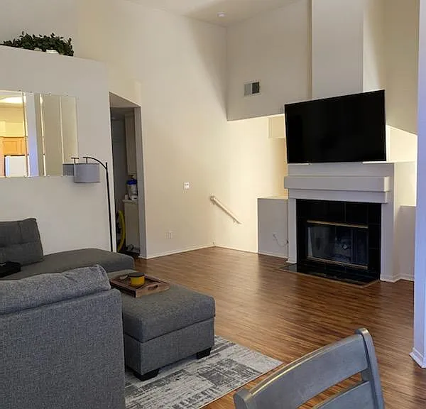 Living room with vaulted ceilings and fireplace