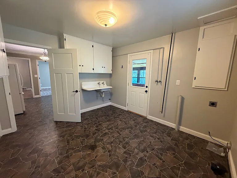 Laundry room off kitchen and garage. Can also access enclosed patio.