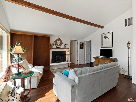 A look at the large and updated great room with a new wood burning Lopi fireplace insert.