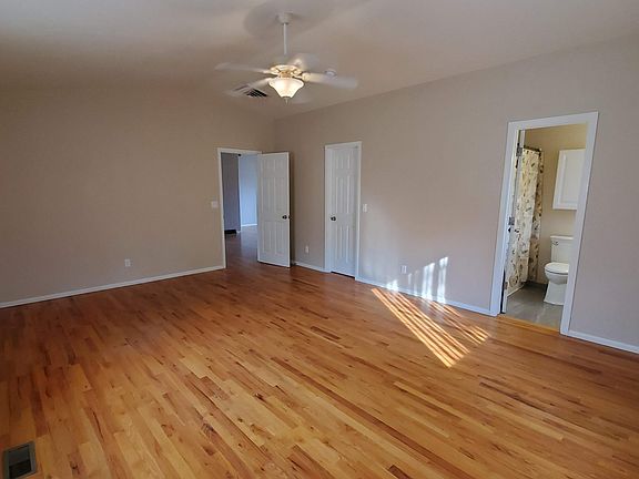 Primary bedroom includes walk-in closet and full bath suite