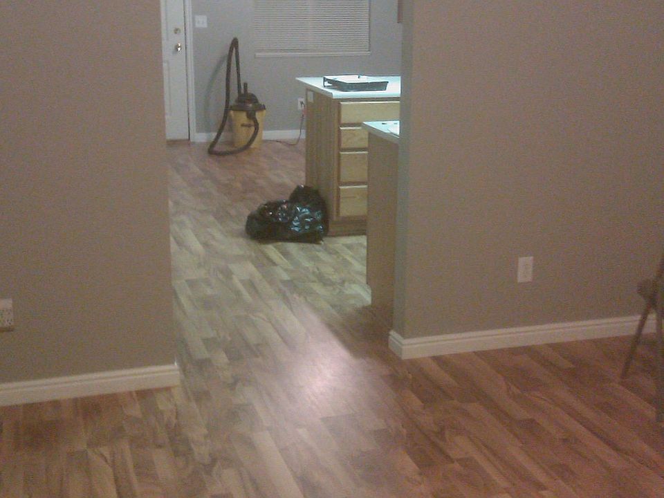 Living room with view to kitchen and dining