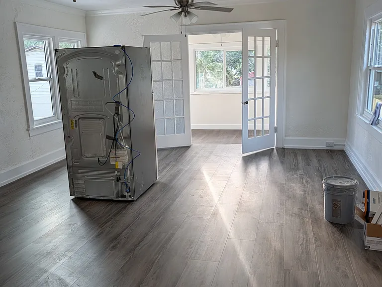 Living room faces front porch which overlooks large lot.