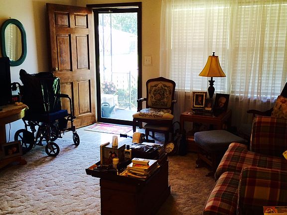Looking west through the living room toward the front door.