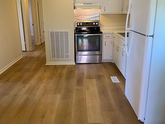 Large eat-in kitchen with BRAND NEW flooring throughout the entire house!
