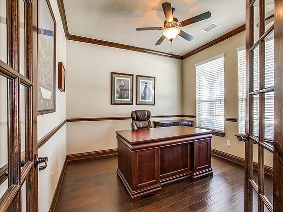 Spacious office with beautiful moldings!