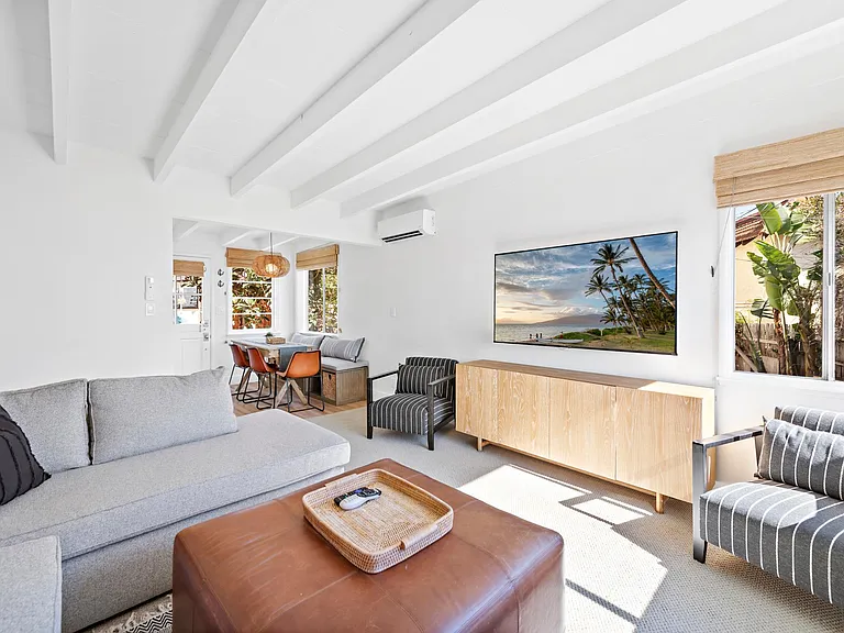 Living room open to dining area, light and bright, ocean breezes abundant here, or use new heating and AC units