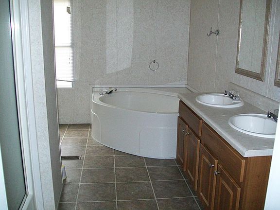 Master bath with large shower and roman tub.