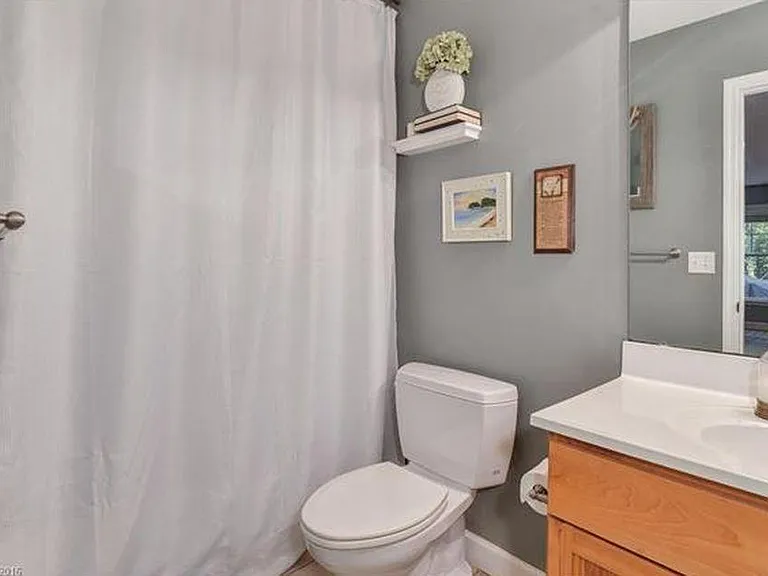 Downstairs bathroom has a full tub.