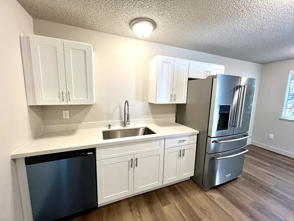 Crisp white cabinetry and stunning white quartz countertops