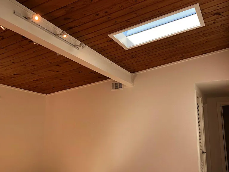 Living room view of the beautiful ceiling with skylights in a Sunny day.