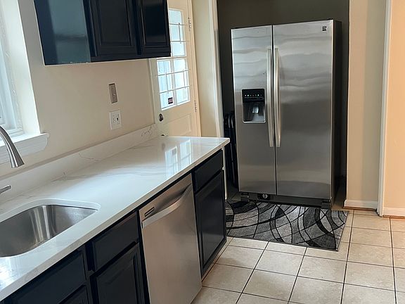 Kitchen with stainless steel appliances.