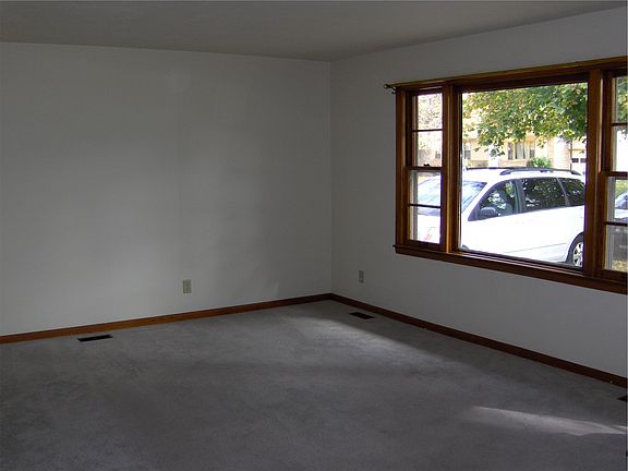 Note: Carpet has been removed. Original Hardwood floors now