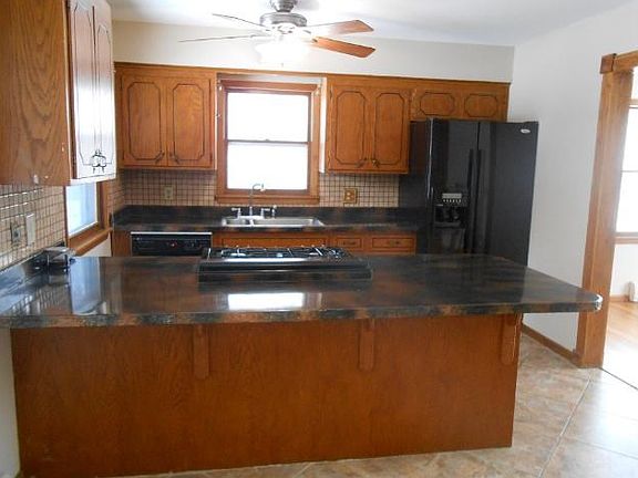 Kitchen has been recently updated.  New appliances in 2014.  Gas range, dishwasher and refrigerator.  The kitchen has custom countertops with loads of storage space.