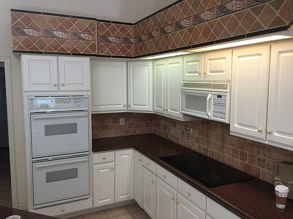 Gourmet kitchen complete with double wall ovens