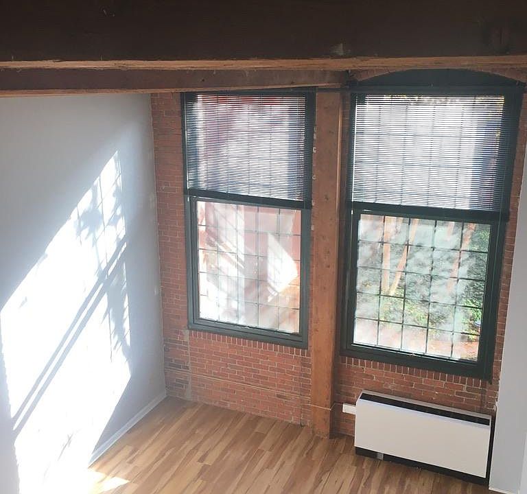 Living room from loft bedroom looking out to interior courtyard