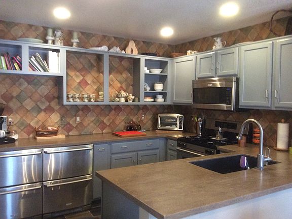 modern kitchen, stone counter top, all stainless steel appli