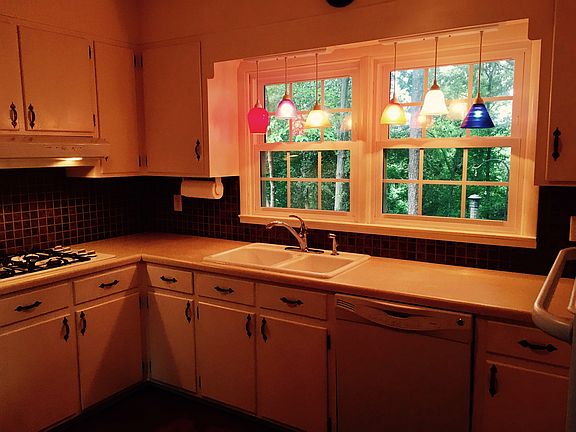 Kitchen overlooks deck & garden