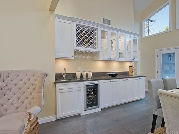 Custom Cabinets with Wine Rack, Wine Fridge, Bar w
