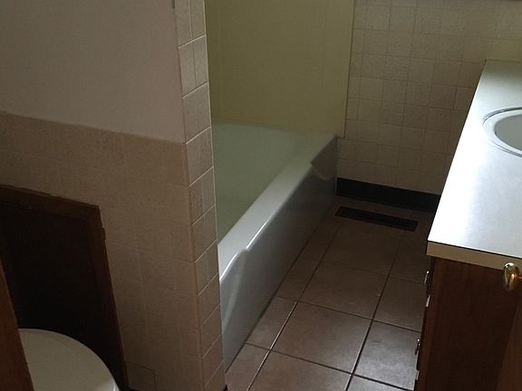 Ceramic tiled bathroom with plenty of storage