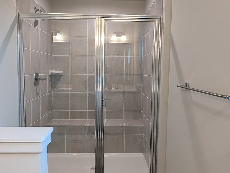 standing shower with bench