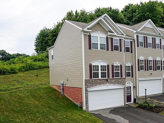 This end unit features plenty of green space, so invite family and friends for yard games.