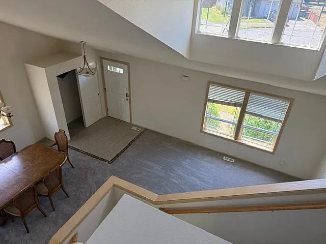 Living Room, Dining Room, and Entry from Upstairs Hall