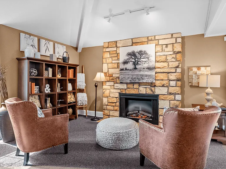 Comfortable resident lounge with cozy seating and TV entertainment.