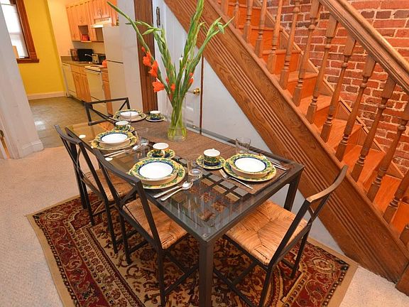 Lovely detailed woodworking in the staircase serves as background
