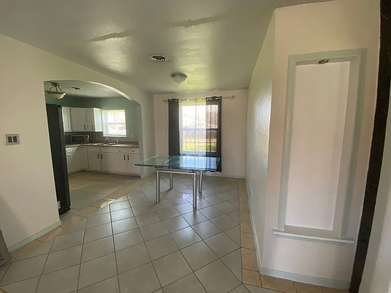 View of dining area from living room. Table has been removed.