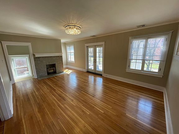Living Room back corner. Balcony French Doors to the right and entry stairwell to the left