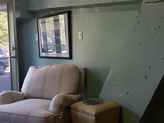 Living room angle showing concrete supports for upper house. This house was designed and built by Austin famous architech AD Stenger.