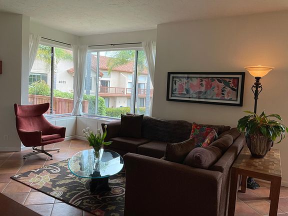 Living room with double paned corner windows overlooking the lake