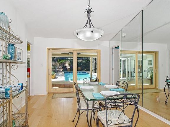 Separate formal dining room with new Pella sliding doors to the lanai