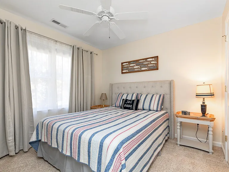 Bedroom two features a queen sized bed and spacious closet.