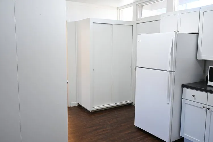 Storage by front entrance of a unit at Kearney Apartment Homes.