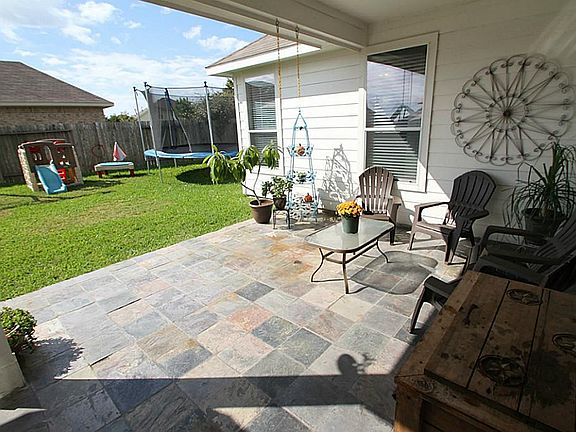 RELAX ON THIS COVERED BACK PORCH
